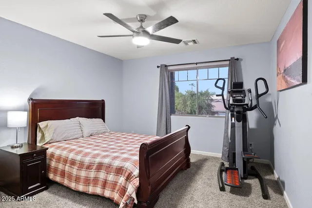 a bedroom with a bed and cabinets