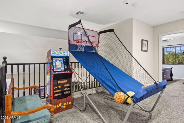 a view of staircase with furniture and a window