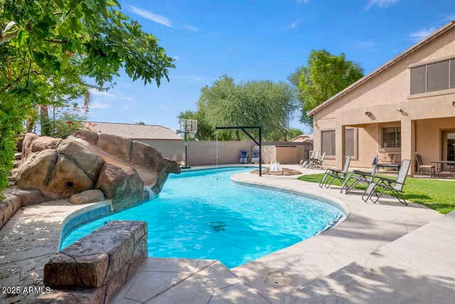 a view of a backyard with sitting area