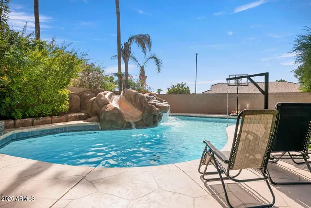 a front view of a house with garden and porch