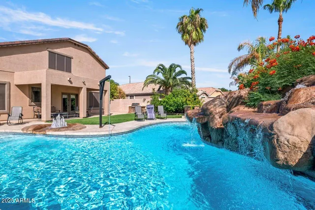 a view of a house with swimming pool and porch with furniture