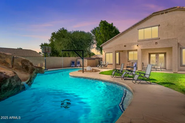 a view of a big house with a swimming pool