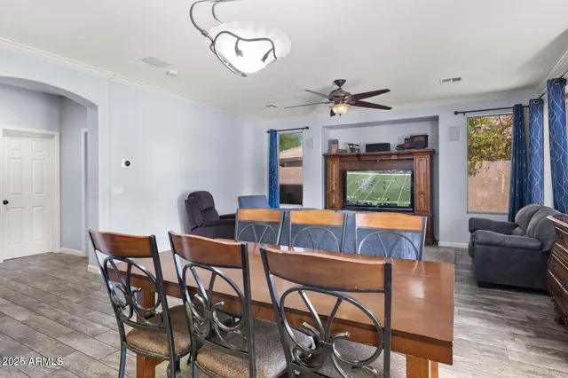 a large kitchen with a table and chairs