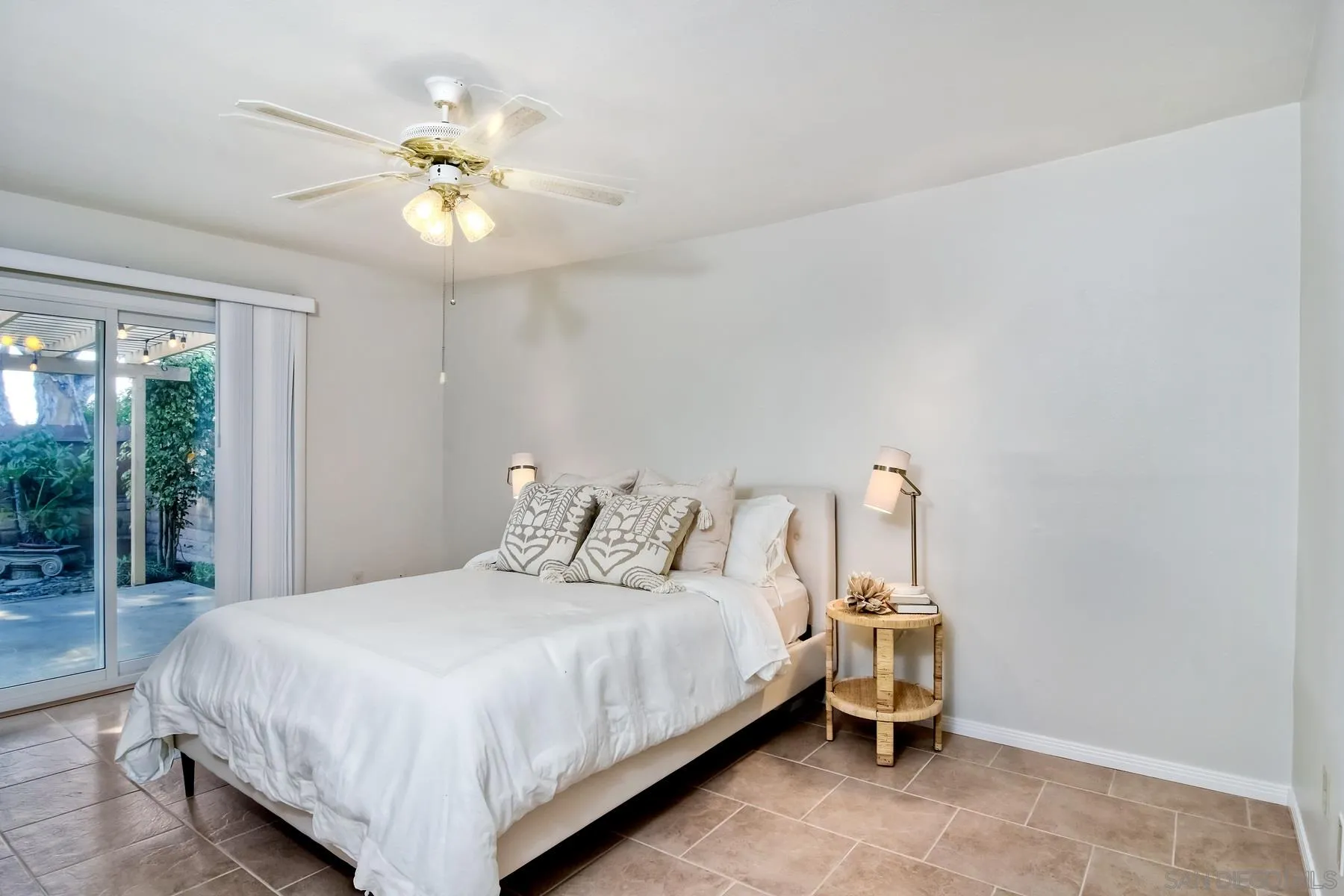 803 Caminito Azul Carlsbad, CA 92011 - Photo 21 of 41 a bedroom with a bed and a chandelier