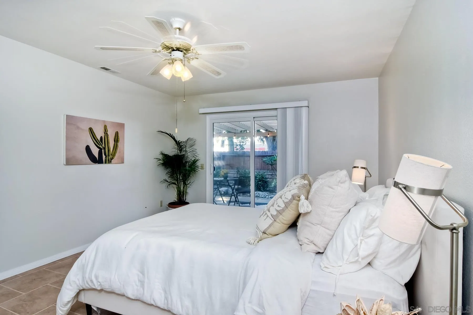 803 Caminito Azul Carlsbad, CA 92011 - Photo 22 of 41 a bedroom with a bed and a chandelier