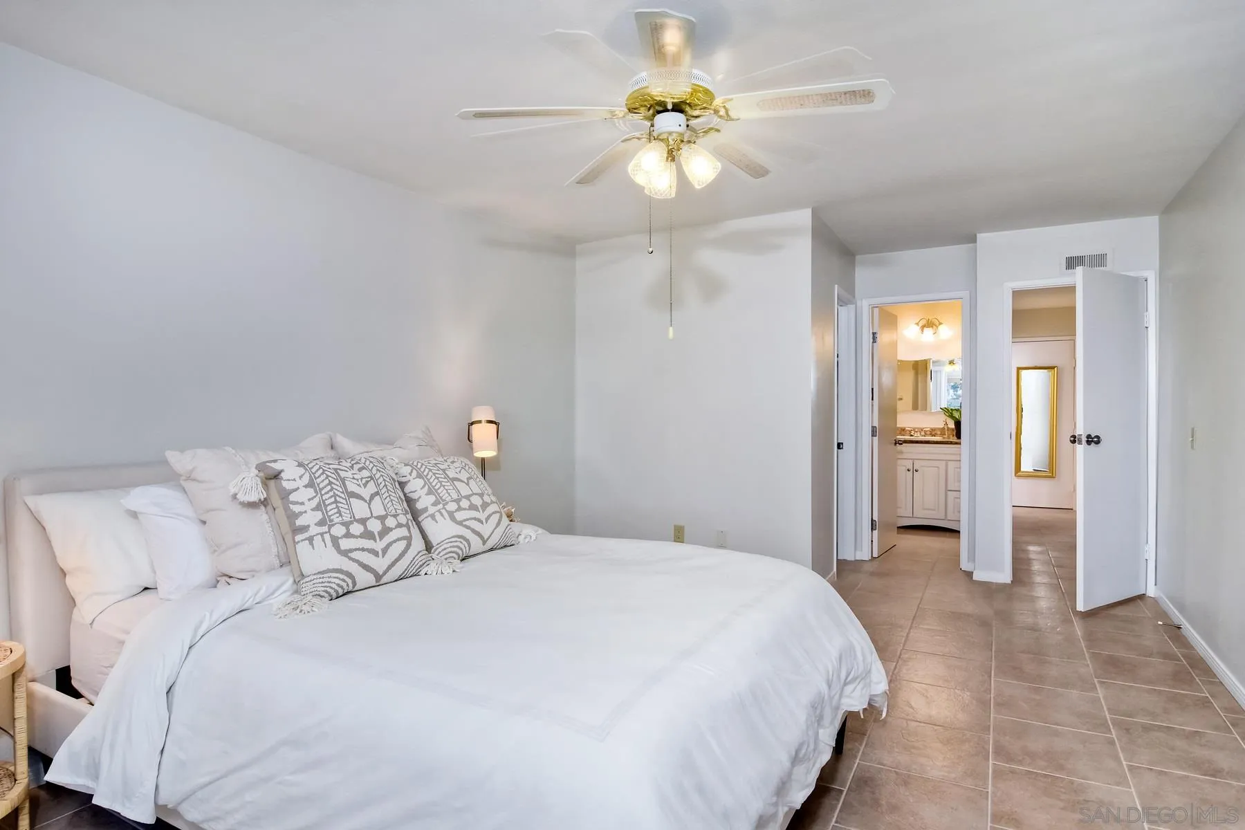 803 Caminito Azul Carlsbad, CA 92011 - Photo 24 of 41 a bedroom with a bed and a chandelier