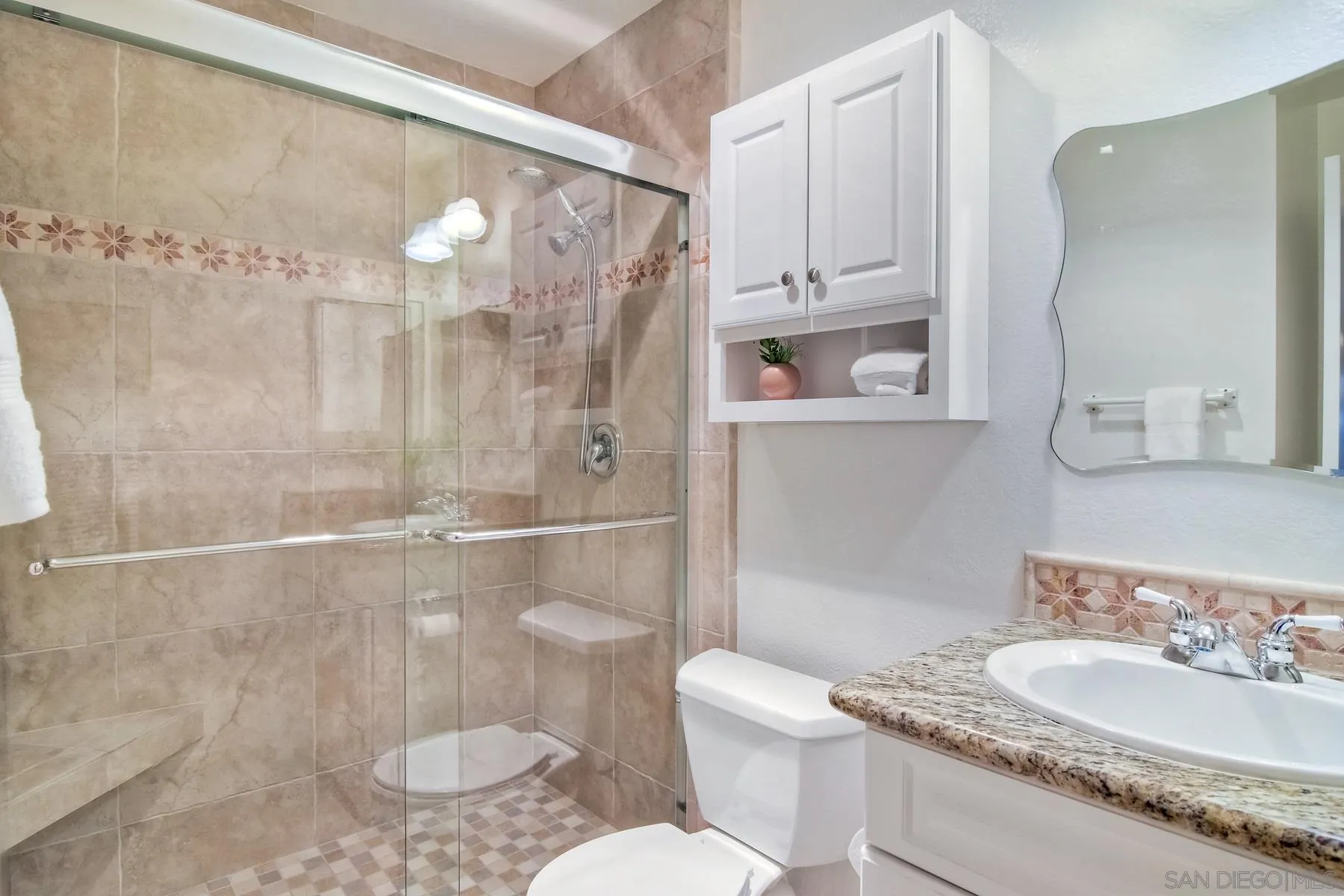 803 Caminito Azul Carlsbad, CA 92011 - Photo 27 of 41 a bathroom with a sink a toilet and shower