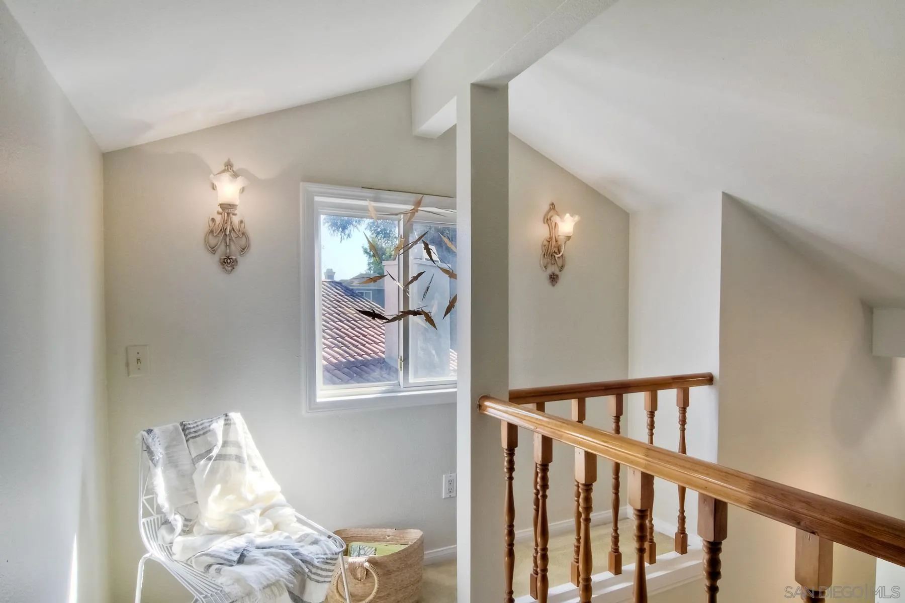 803 Caminito Azul Carlsbad, CA 92011 - Photo 30 of 41 a view of a hallway with paintings on the wall