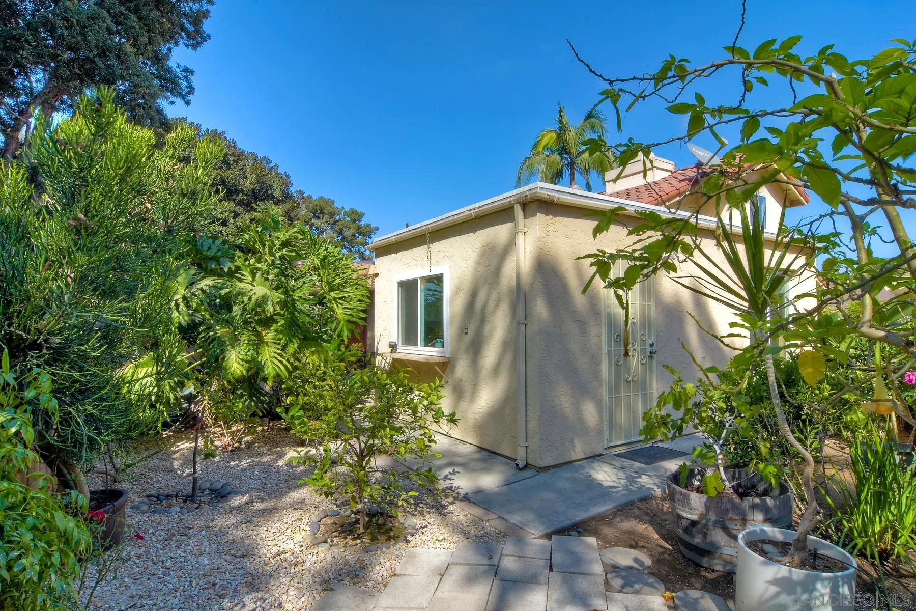 803 Caminito Azul Carlsbad, CA 92011 - Photo 35 of 41 a backyard of a house with lots of green space