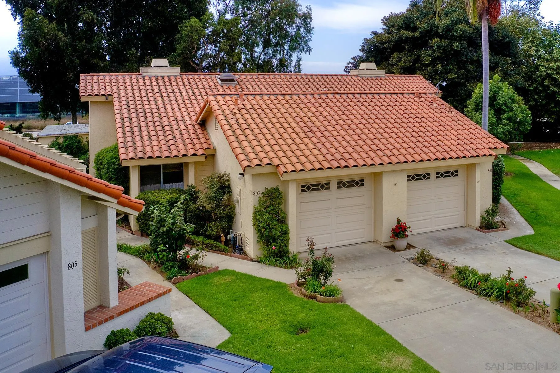 803 Caminito Azul Carlsbad, CA 92011 - Photo 39 of 41 a front view of a house with garden