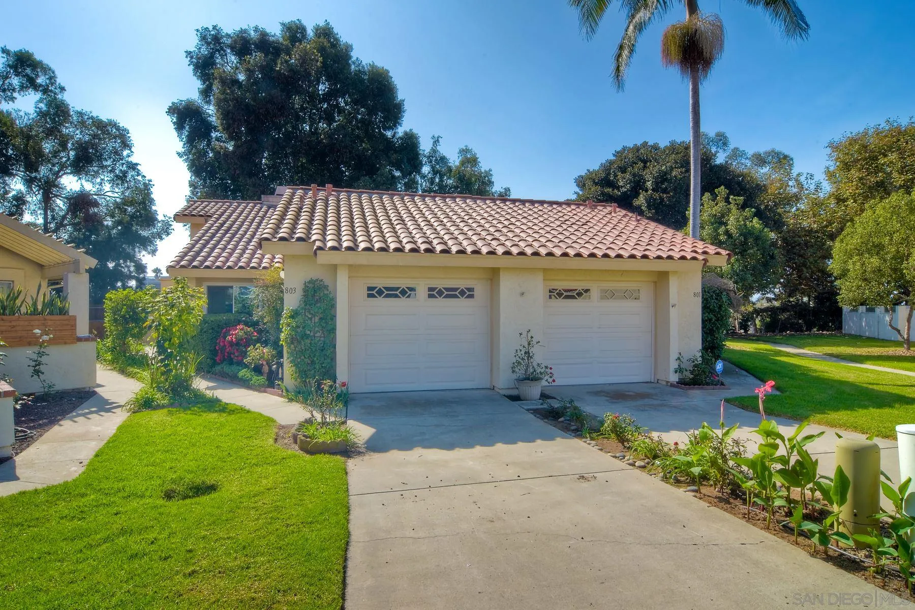 803 Caminito Azul Carlsbad, CA 92011 - Photo 4 of 41 a front view of a house with garden