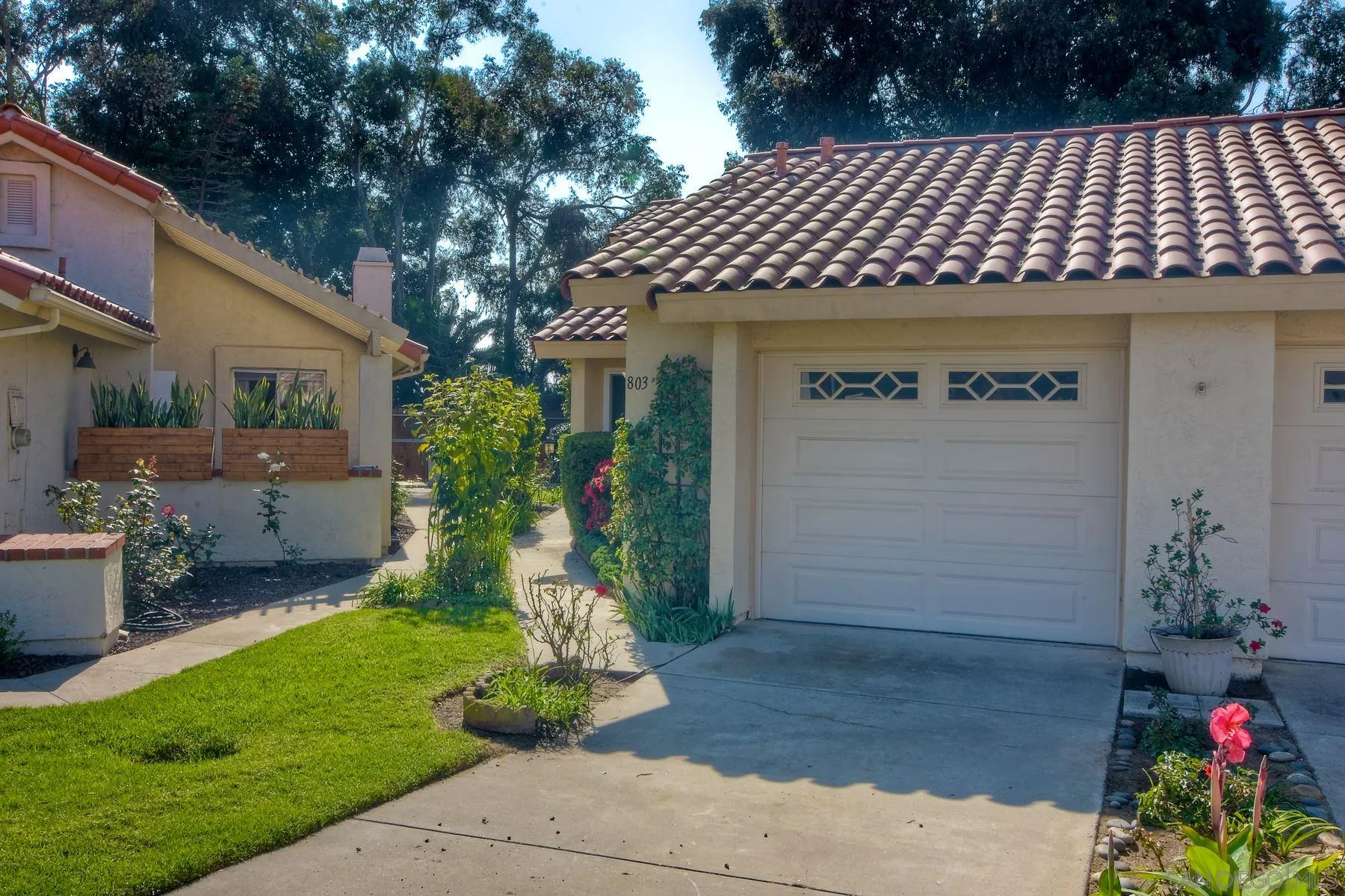 803 Caminito Azul Carlsbad, CA 92011 - Photo 5 of 41 a front view of a house with a yard