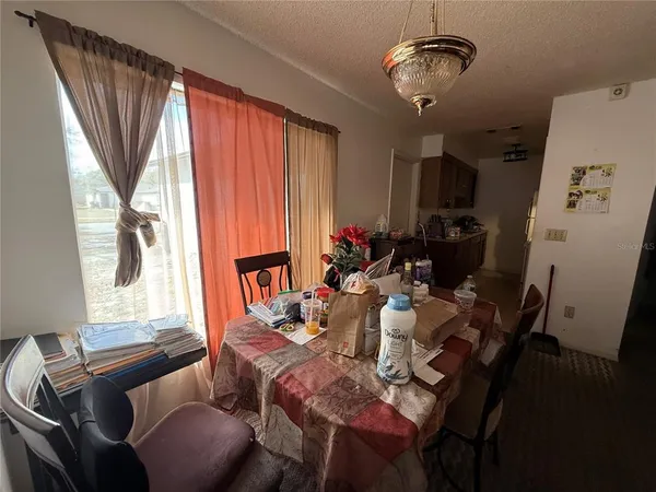 a view of a dining room with furniture window and outside view