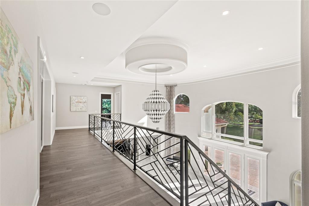 11255 Macaw Court Windermere, FL 34786 - Photo 25 of 49 a view of a hallway with wooden floor and windows
