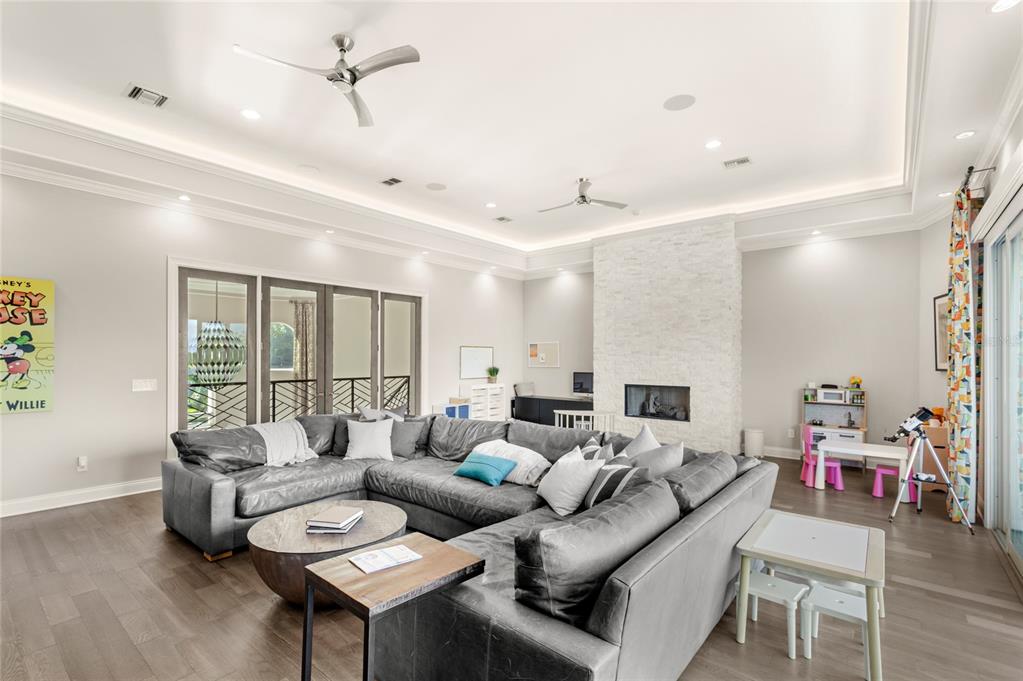 11255 Macaw Court Windermere, FL 34786 - Photo 27 of 49 a living room with furniture and wooden floor