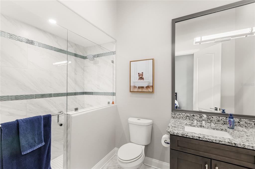 11255 Macaw Court Windermere, FL 34786 - Photo 35 of 49 a bathroom with a sink toilet a mirror and shower