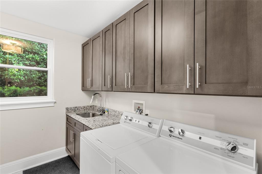 11255 Macaw Court Windermere, FL 34786 - Photo 37 of 49 a bathroom with a sink and a window