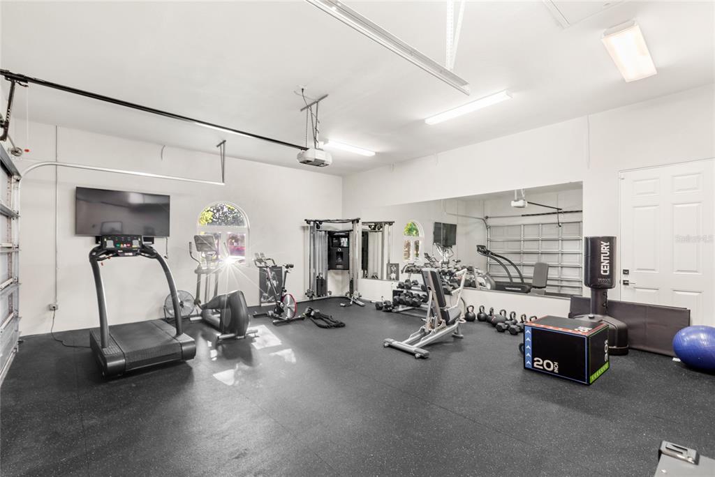 11255 Macaw Court Windermere, FL 34786 - Photo 38 of 49 a view of a room with gym equipment