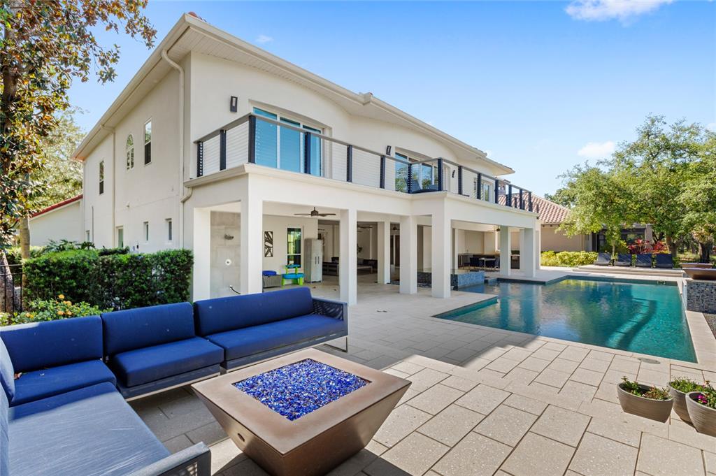 11255 Macaw Court Windermere, FL 34786 - Photo 40 of 49 a view of a white house with a yard