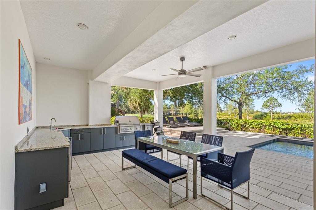11255 Macaw Court Windermere, FL 34786 - Photo 43 of 49 a living room with furniture and large windows