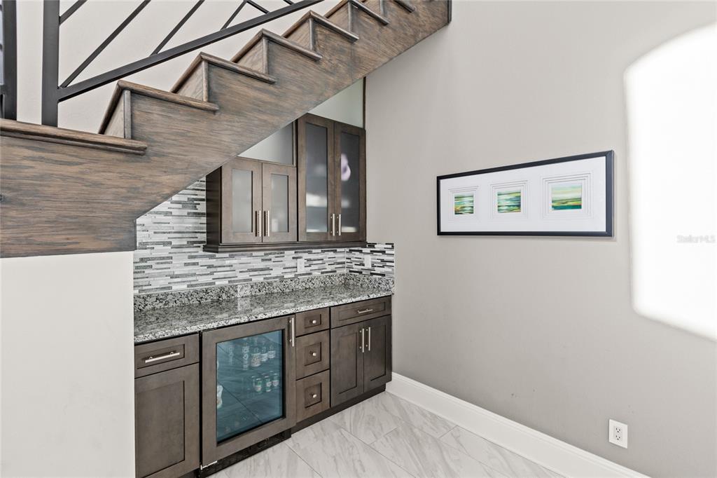 11255 Macaw Court Windermere, FL 34786 - Photo 9 of 49 a bathroom with a granite countertop sink and a mirror