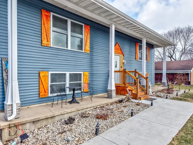 a view of a brick house with large windows