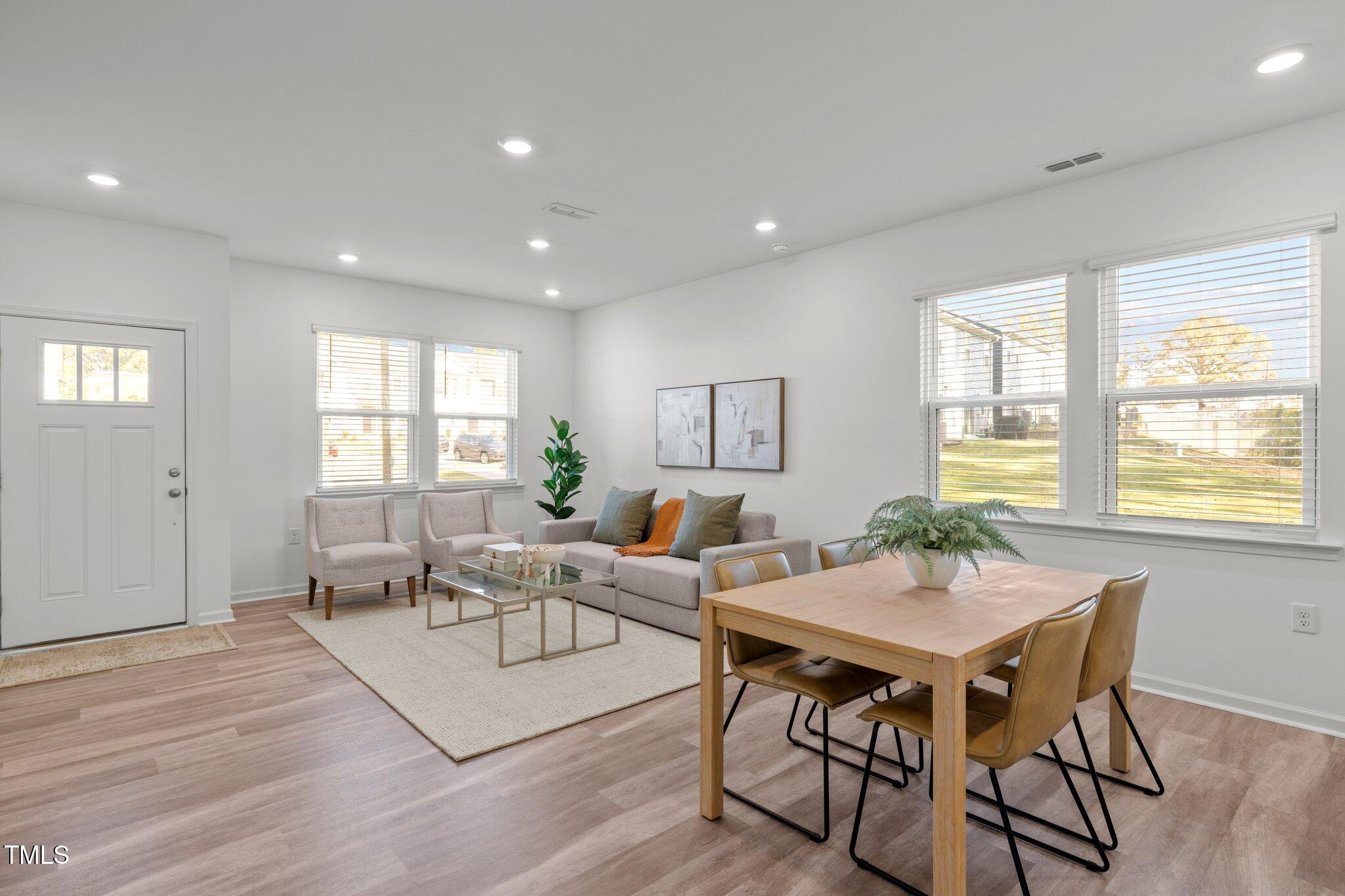 3120 Crater Loop Raleigh, NC 27610 - Photo 5 of 19 a living room with furniture and wooden floor