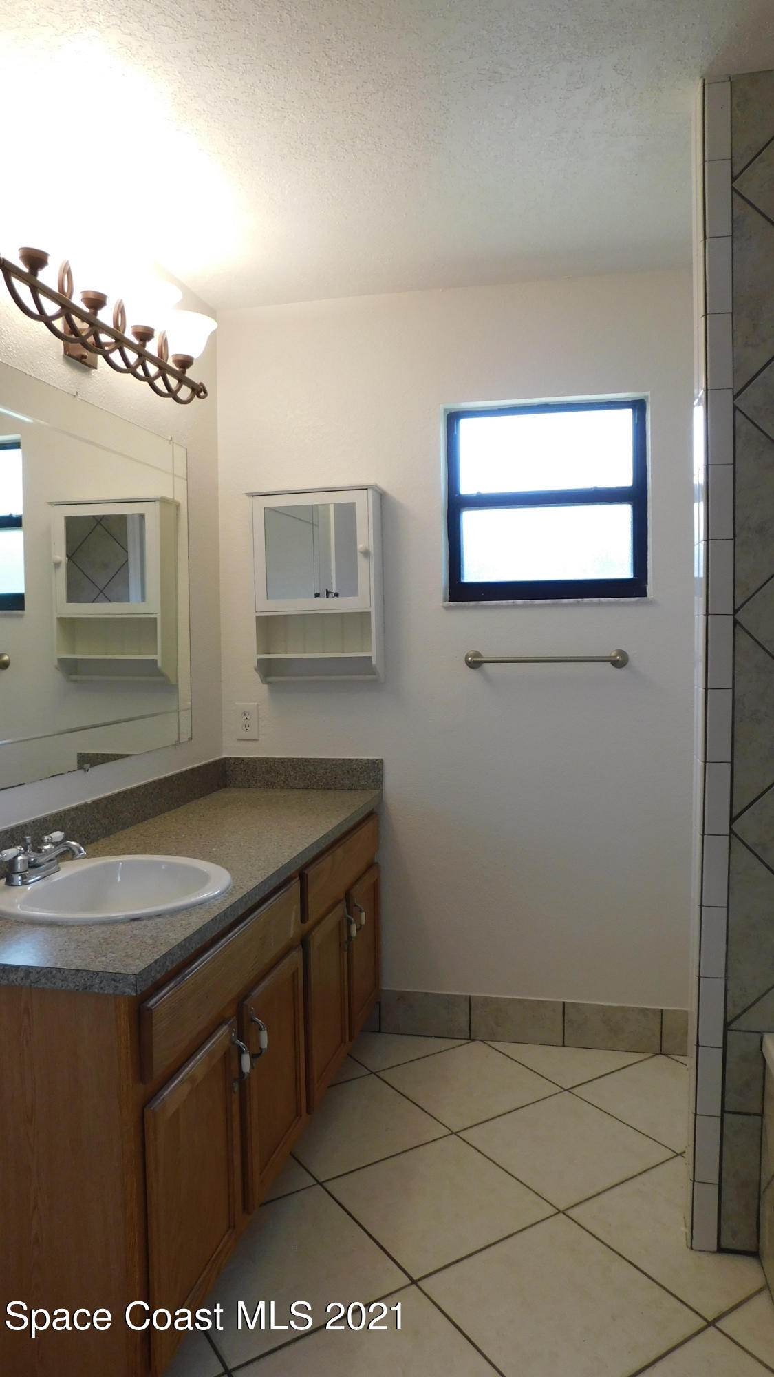 6054 Cardiff Avenue Cocoa, FL 32927 - Photo 14 of 20 Cardiff Master Bathroom 1 - 1
