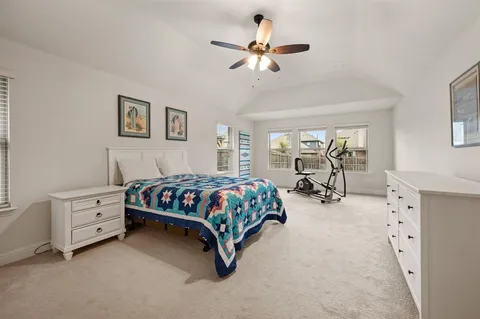 a bedroom with furniture and window