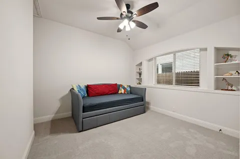 a living room with furniture and windows
