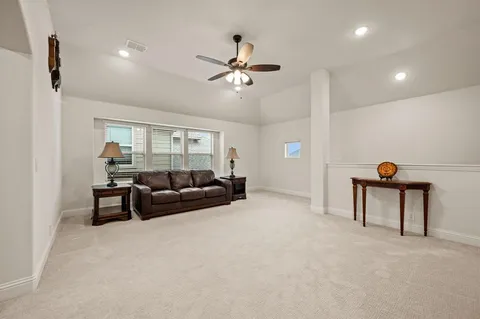 a living room with furniture and a table