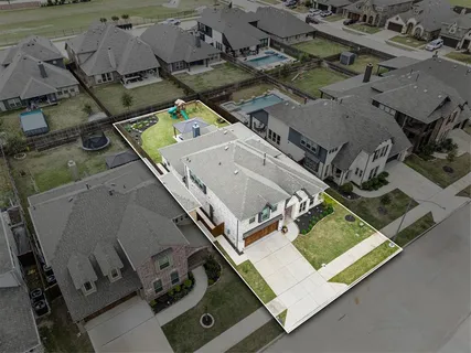 an aerial view of residential house with outdoor space