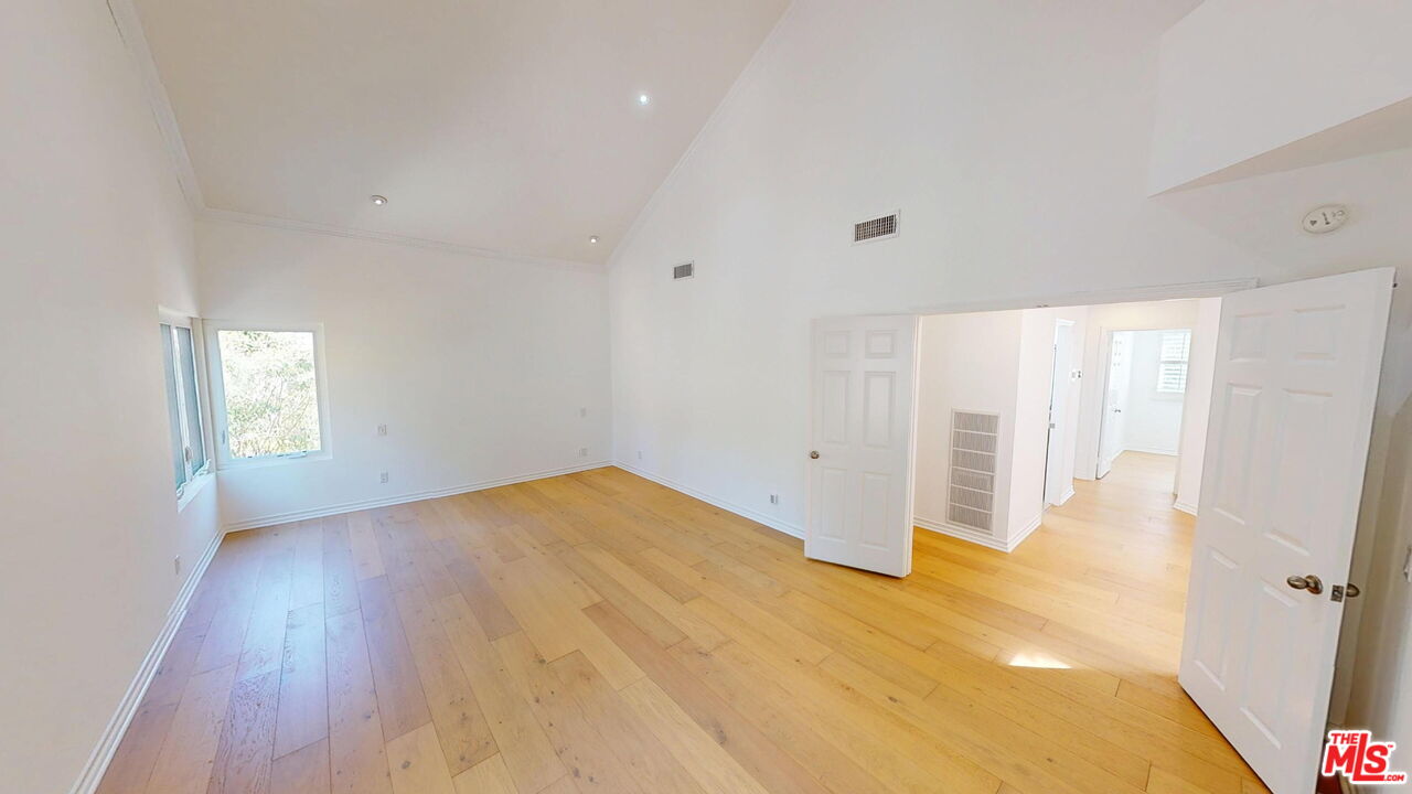 19219 Dunure Place Porter Ranch, CA 91326 - Photo 13 of 30 a view of empty room with wooden floor