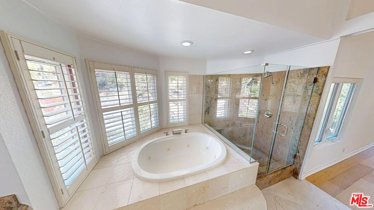 19219 Dunure Place Porter Ranch, CA 91326 - Photo 15 of 30 a bathroom with a bathtub and a sink