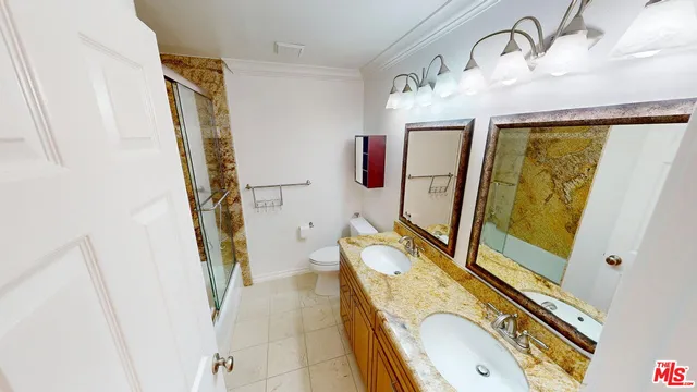 a bathroom with a sink a mirror and shower