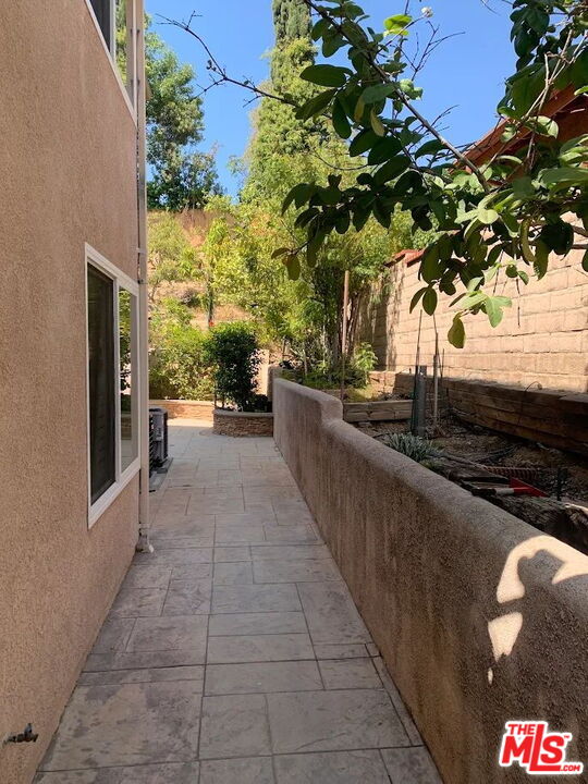 19219 Dunure Place Porter Ranch, CA 91326 - Photo 22 of 30 a view of a terrace with a garden