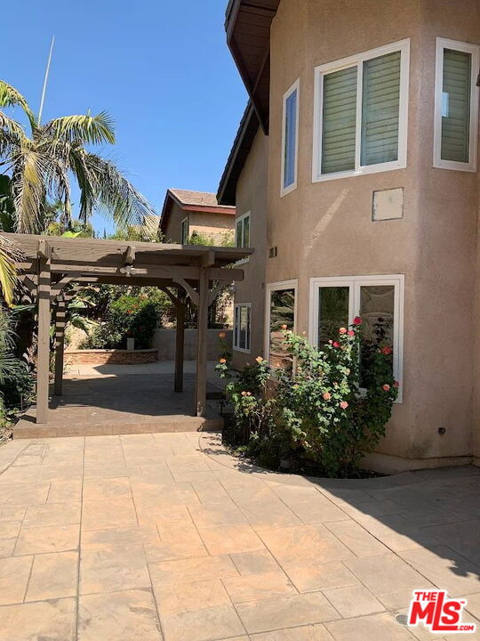19219 Dunure Place Porter Ranch, CA 91326 - Photo 28 of 30 a view of a building with potted plants