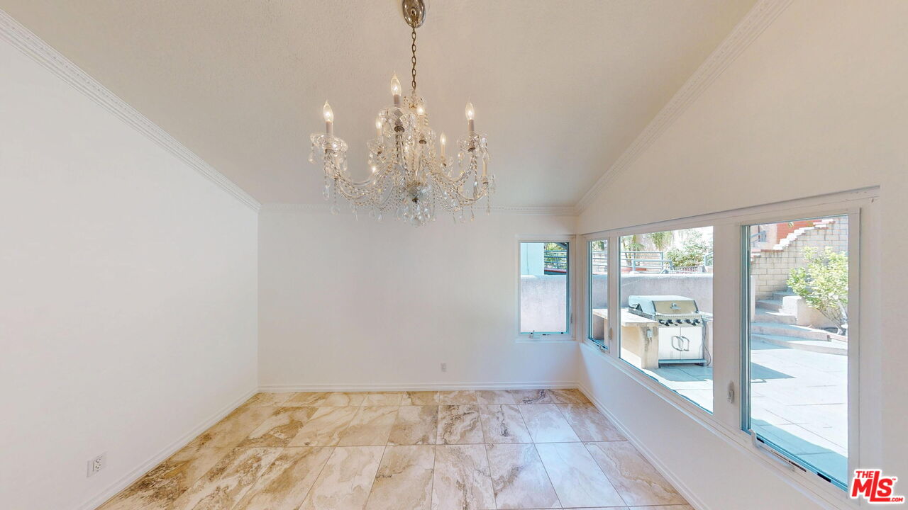 19219 Dunure Place Porter Ranch, CA 91326 - Photo 7 of 30 a view of a big room with wooden floor windows and a chandelier
