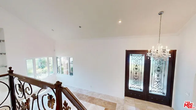 a view of a hallway with windows