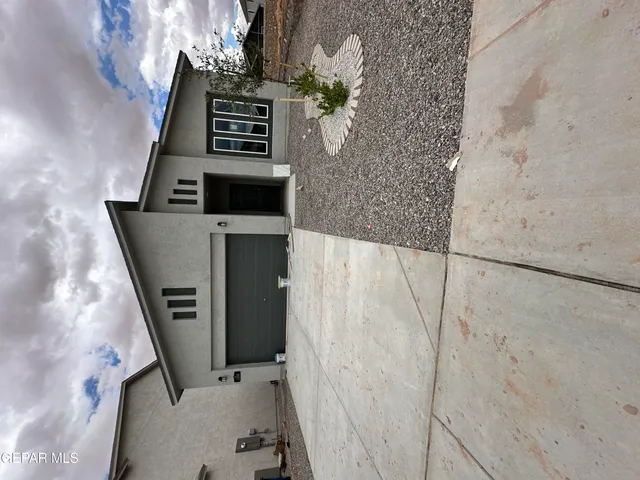 a view of an empty room with windows