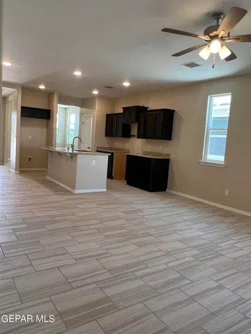 a view of kitchen with furniture and window