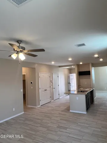 a view of a kitchen with a sink and a window