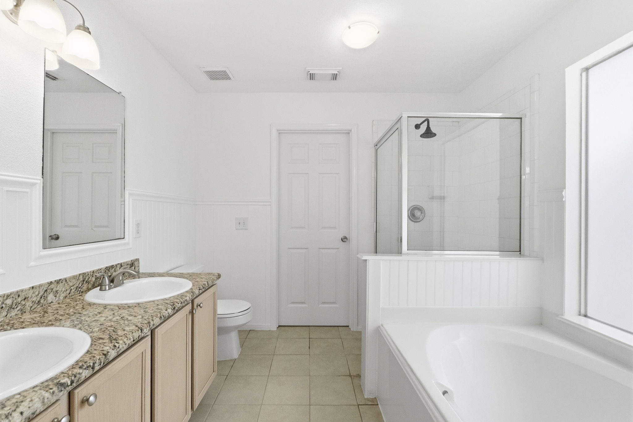 11907 Ezekiel Road Tomball, TX 77375 - Photo 27 of 39 a bathroom with a granite countertop sink toilet and shower
