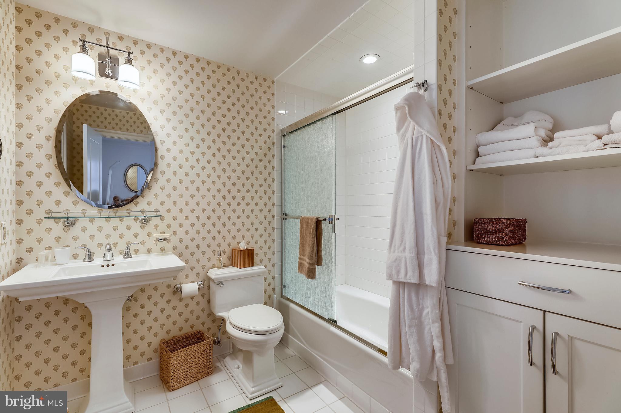 101 Taplow Road Baltimore, MD 21210 - Photo 36 of 59 a bathroom with a toilet sink and mirror