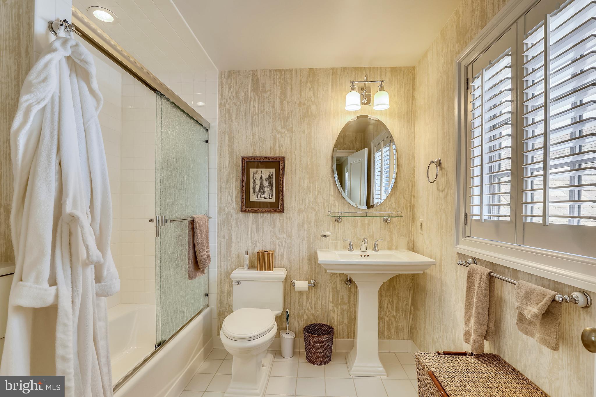 101 Taplow Road Baltimore, MD 21210 - Photo 39 of 59 a bathroom with a sink toilet and a mirror