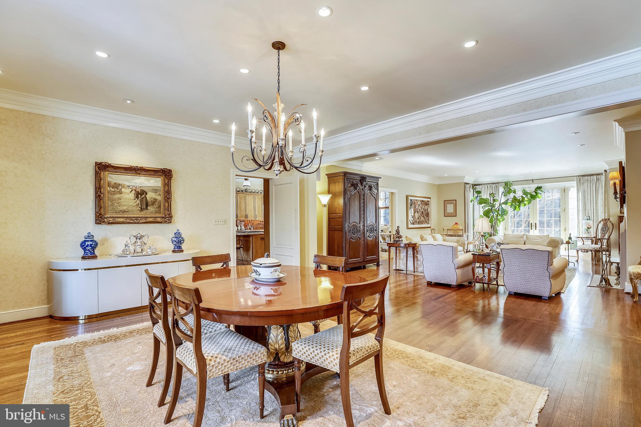 101 Taplow Road Baltimore, MD 21210 - Photo 8 of 59 a view of a dining room with furniture a chandelier and wooden floor