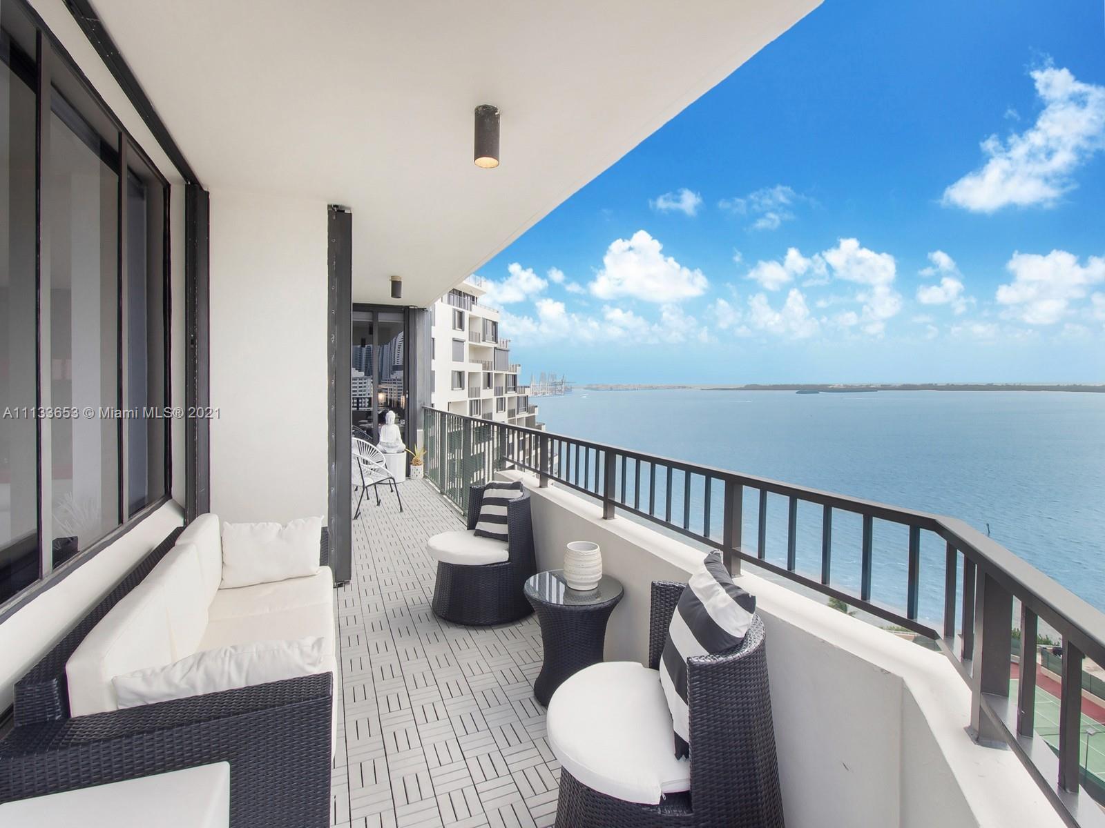 520 Brickell Key Drive, Unit A1815 Miami, FL 33131 - Photo 1 of 34 a view of a balcony dining table and chairs