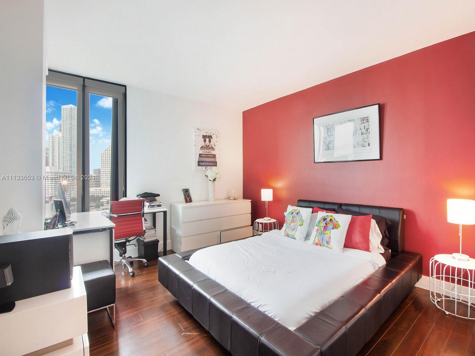 520 Brickell Key Drive, Unit A1815 Miami, FL 33131 - Photo 16 of 34 a bed room with a bed and a table