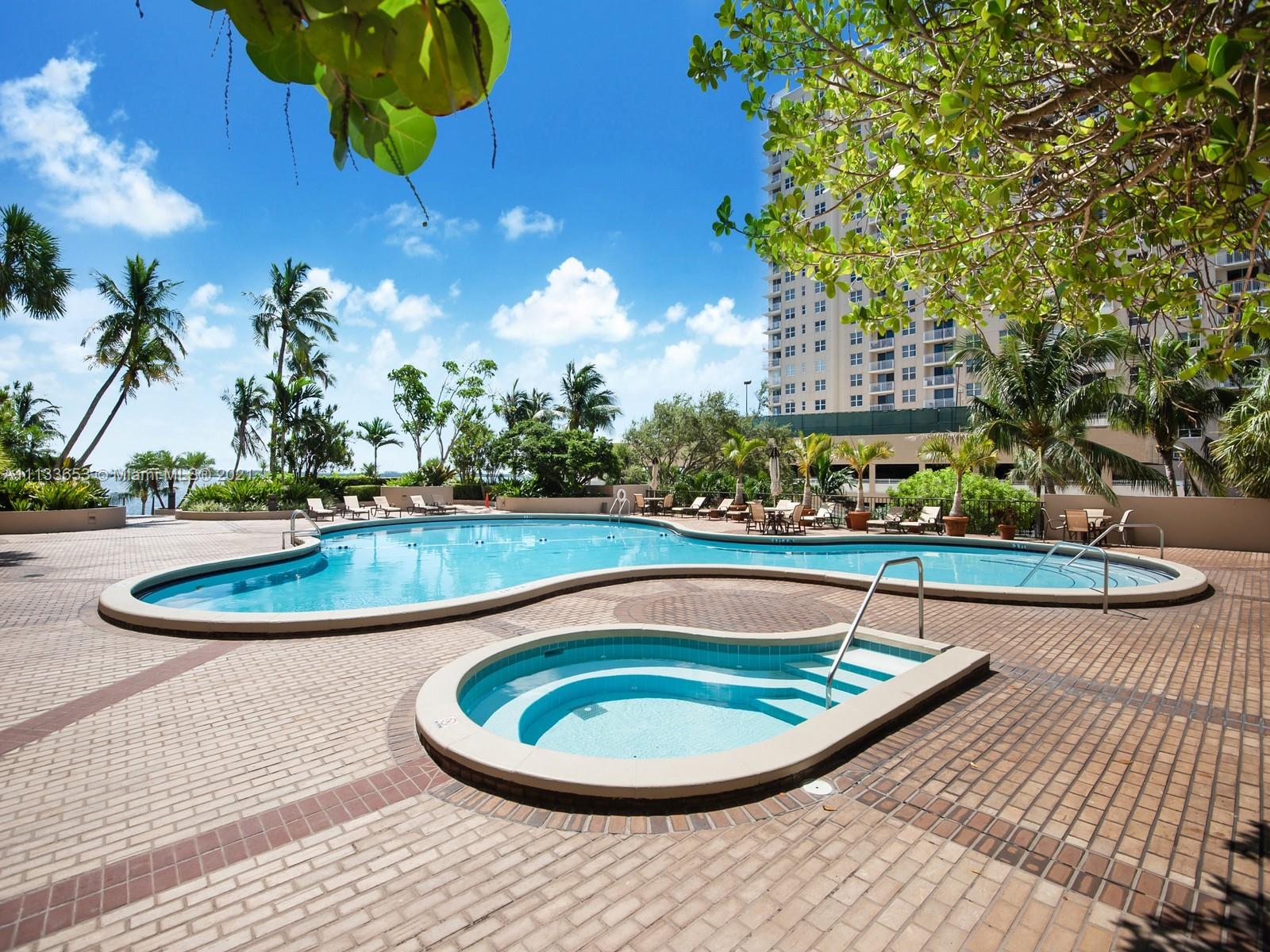 520 Brickell Key Drive, Unit A1815 Miami, FL 33131 - Photo 18 of 34 a view of a swimming pool with a patio