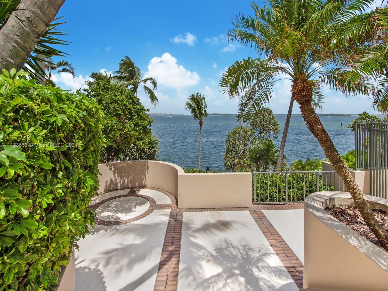 520 Brickell Key Drive, Unit A1815 Miami, FL 33131 - Photo 20 of 34 a view of a backyard with swimming pool and sitting area